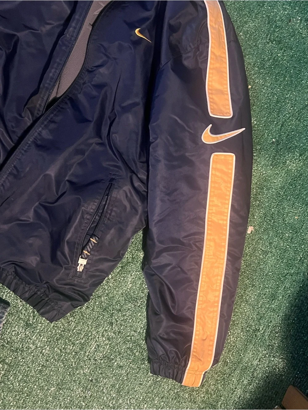Nike Men’s Navy Windbreaker Jacket with Gold Stripe Accents